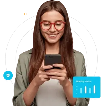 Advertiser using a smartphone beside a website traffic graphic