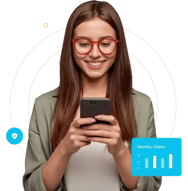 Advertiser using a smartphone beside a website traffic graphic
